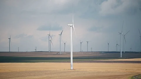 Wind turbines in a wind farm with a dramatic stormy sky in the background 스톡 동영상 112342060