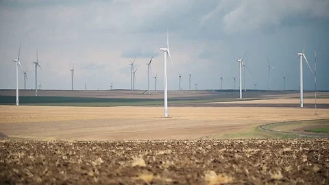 Wind turbines in a wind farm with a dramatic stormy sky in the background 스톡 동영상 112342079
