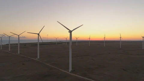 Wind turbines at wind farm generating Renewable energy at sunset Stock Footage 137626101