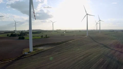 Wind Turbines In A Wind Farm Generating Clean Green Energy On Open Grass Field Stock Footage 138442287