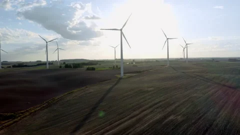 Wind Turbines In A Wind Farm Generating Clean Green Energy On Open Grass Field Stock Footage 138442665