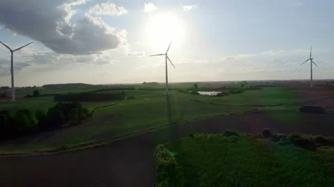 Wind Turbines In A Wind Farm Generating Clean Green Energy On Open Grass Field Stock Footage 138443143