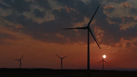 Wind Turbines on a Wind farm at Sunset Stock Footage 196294576