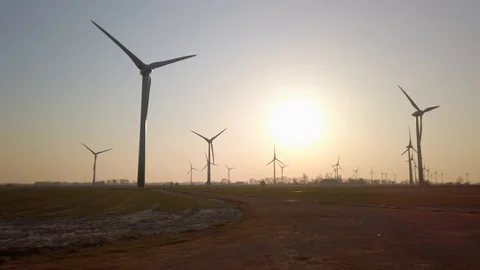Wind turbines in windpark at sundown Video stock 128224796
