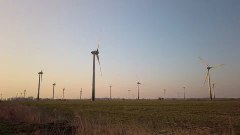 Wind turbines in windpark at sundown Video stock 128226145