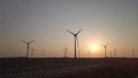 Wind turbines in windpark at sundown Video stock 128228208