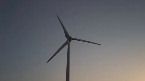 Wind turbines in windpark at sundown Video stock 128229492