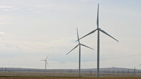Wind turbines work in the field Stock Footage 121299823