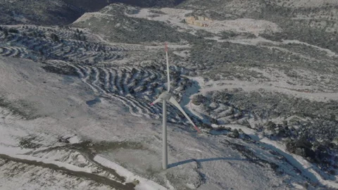 Wind turbines working in winter, snow capped, sunny, drone footage, jk01 Stock Footage 272234310