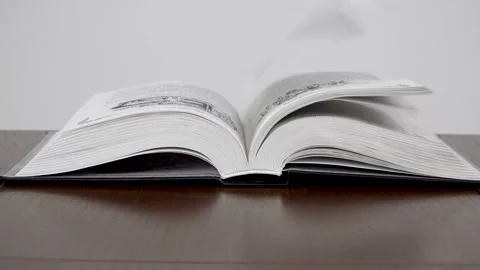 The wind turns the pages of the book Stock Footage 141373469