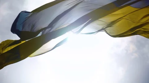 The wind is waving the flag of Ukraine against the background of the blue sky Vidéo 201215467