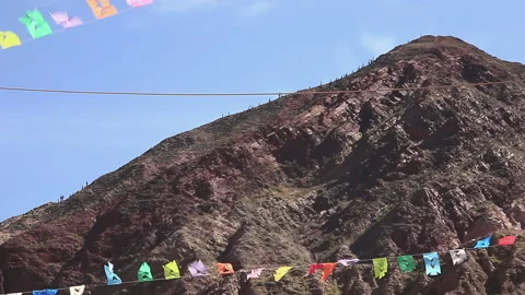 Wind Waving Flags Fith Mountains In The Background Video stock 152574030