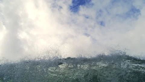 Windblown Ocean Swell Throwing Fine Spray Beneath Dense White Clouds Stock Footage 344382860