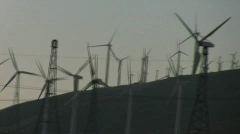 Windfarm pan across sunset Stock Footage 695216