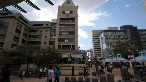 Windhoek palaces, walking people, Namibia, Africa in 4K, cloudy day Stock Footage 90778124