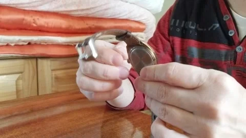 Winding an antique soviet watch Stock Footage 255455054