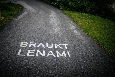 A winding asphalt path with a painted shared. Stock Photos