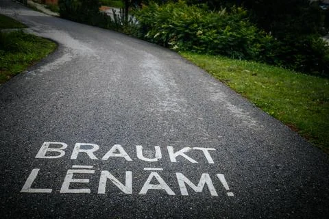 A winding asphalt path with a painted shared. Stock Photos