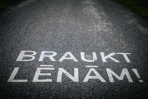 A winding asphalt path with a painted shared. Stock Photos