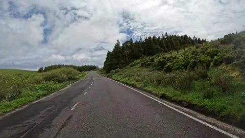Winding Asphalt Road Through Lush Forests and Hills on Flores Island, Azores Видео 336702234
