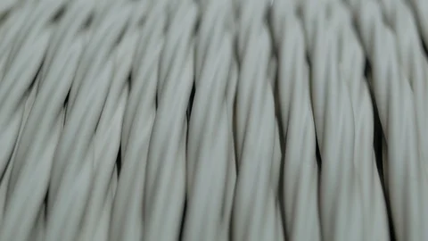 Winding cable on a rotating coil. Production of electric cable. Stock Footage 125380371