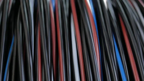 Winding the cable in the shell on a rotating coil. Production of electric cable Stock Footage 125414088