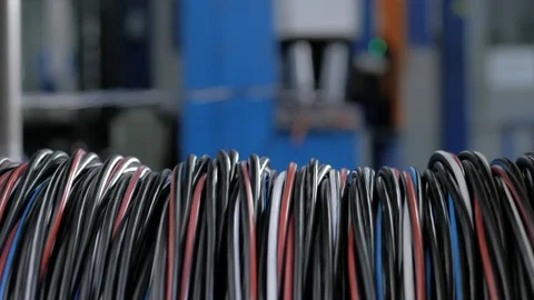 Winding the cable in the shell on a rotating coil. Production of electric cable Stock Footage 125414092