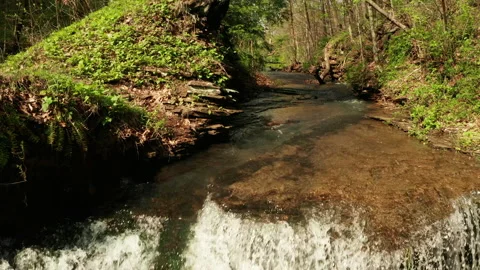 Winding creek with Waterfall Stock Footage 153870770