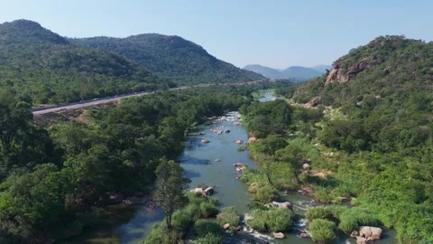 Winding Crocodile River flowing across tranquil valley Stock Footage 340263355