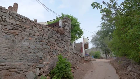 Winding Dirt Path Through a Secluded Village in Rajasthan Stock Footage 311002261