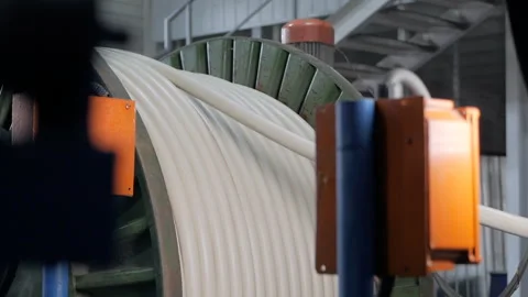 Winding of the electrical cable to the bobbin in the production. Cable Stock Footage 148532087