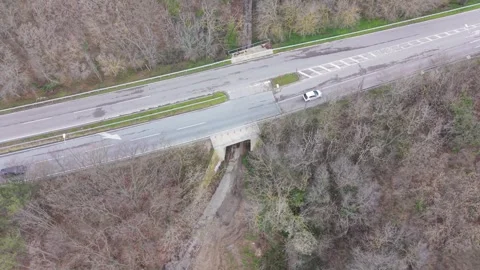 Winding forest road captured from above with drone perspective Stock-Footage 332773565