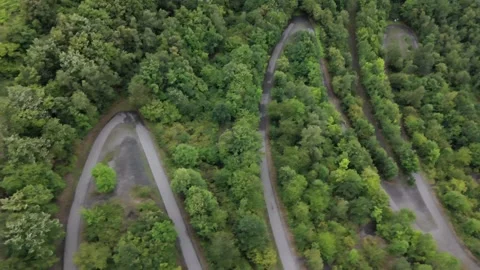 Winding Hairpin Paths Top Down Aerial Through Green Forest Stockbeeldmateriaal 341671090
