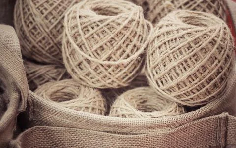Winding the hand ball of string rope cotton in basket material handmade craft Stock Photos