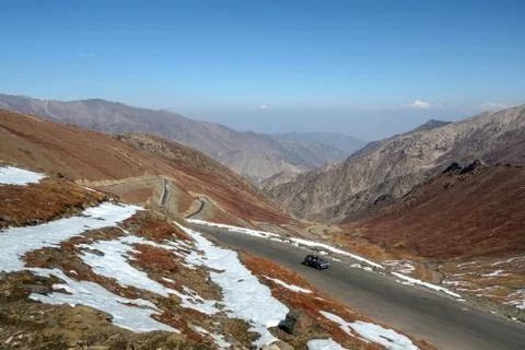 Winding highway on Babusar road with a view of mountain range. Stock Photos