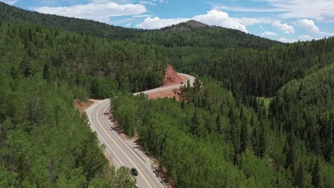 Winding highway in tree covered mountains, Teller County, Colorado, USA Stock Footage 129212215