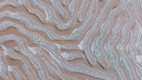 A winding line pattern with a rough texture in cream and white, resembling a nat Stock Footage 300338737