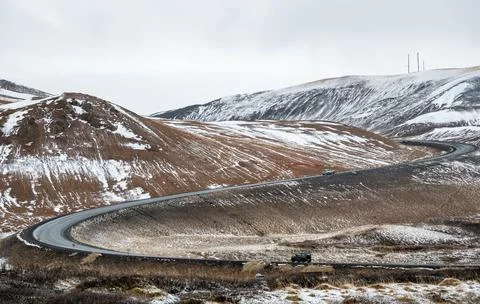 Winding mountain pass ring road . iceland icelandic landscape frozen land Stock Photos