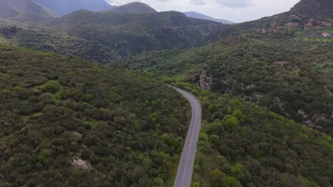Winding Mountain Road Above Forested Gorge, Greece Stock Footage 337051540