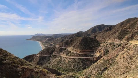 Winding mountain road along rugged cliffs, Mirador de la Granatilla, Spain Stock Footage 321307814