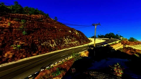 Winding Mountain Road with Cable Car Infrastructure Stock Footage 310323865