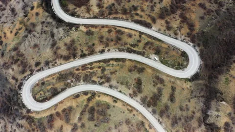 Winding mountain road, serpentine, top view. Aerial view. Mountain landscape.	 Stock Footage 154128173