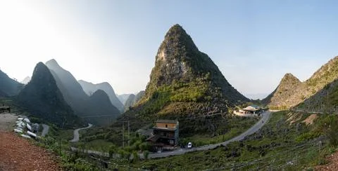 Winding mountain road through dramatic karst peaks in Ha Giang, Vietnam Stock Photos