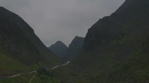 Winding Mountain Road Through Ha Giang Pass in late evening Stock Footage 336717155
