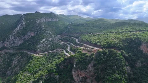 Winding Mountain Road Through Rocky Hills in Greece Stock Footage 336562643