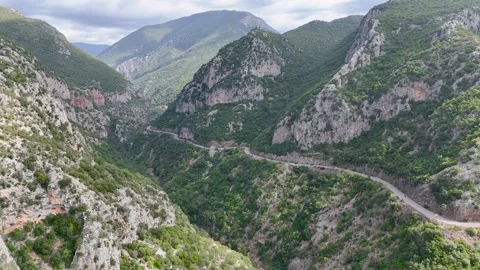 Winding Mountain Road Through Rocky Gorge in Greece Stock Footage 336564967