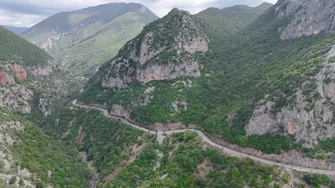 Winding Mountain Road Through Rocky Gorge in Greece Stock Footage 336565197