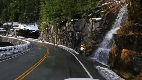 Winding Mountain Road Through Snowy Forest Landscape in Winter at Mount Rainier Video stock 332143971