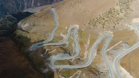 Winding mountain road which passing through Kyrgyzstan mountains. Too-Ashu Pass. Stock Footage 321858612