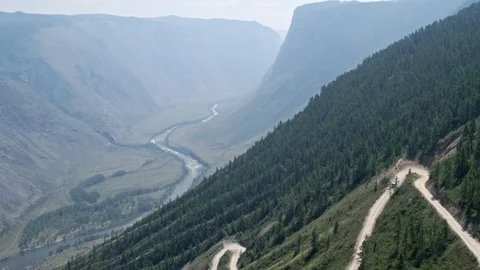 Winding pass, view of the mountains and the river, driving on the road car, 4k Stock Footage 124985885